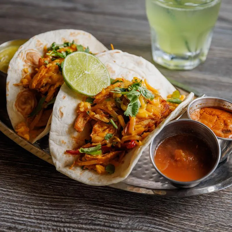 Nasha signature dishes Tikka Con QuesoLamb BiryaniIndian Tacos